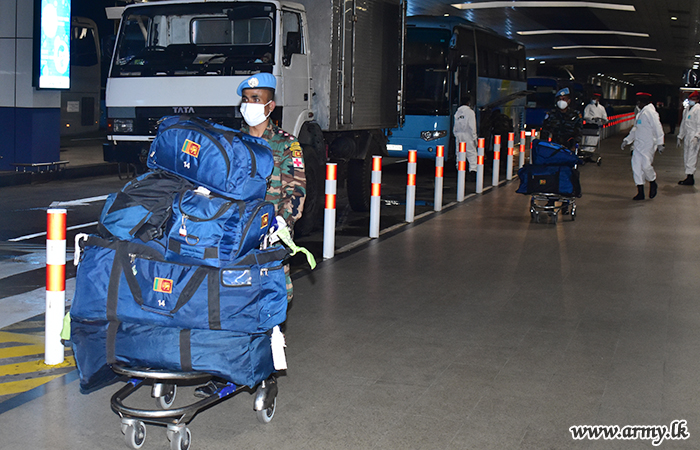 An airman sanitizes indoor shooting stations.