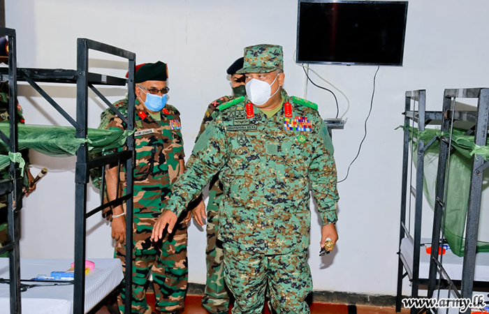 An airman sanitizes indoor shooting stations.