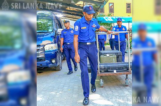 An airman sanitizes indoor shooting stations.