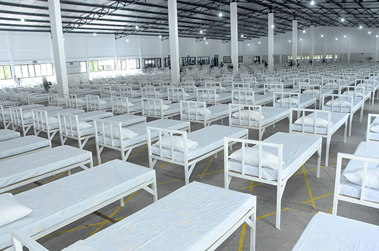 An airman sanitizes indoor shooting stations.
