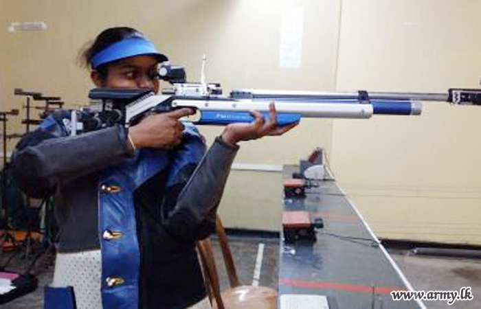 An airman sanitizes indoor shooting stations.