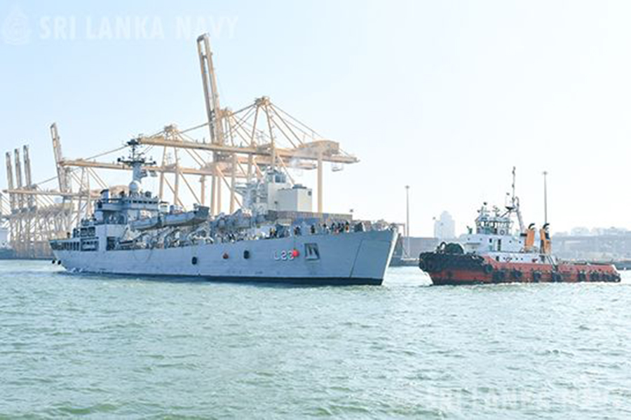 An airman sanitizes indoor shooting stations.