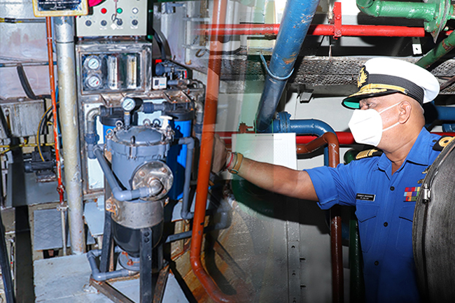 An airman sanitizes indoor shooting stations.