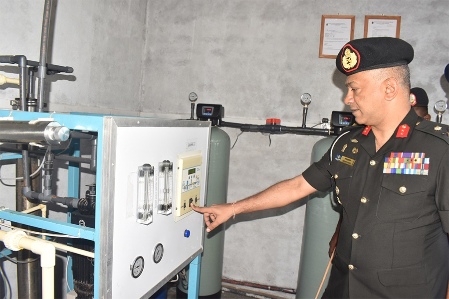 An airman sanitizes indoor shooting stations.