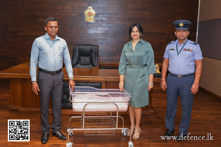 An airman sanitizes indoor shooting stations.