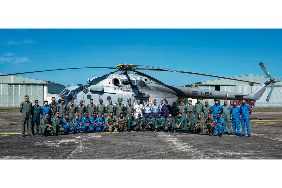 An airman sanitizes indoor shooting stations.