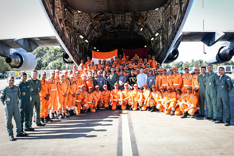 An airman sanitizes indoor shooting stations.