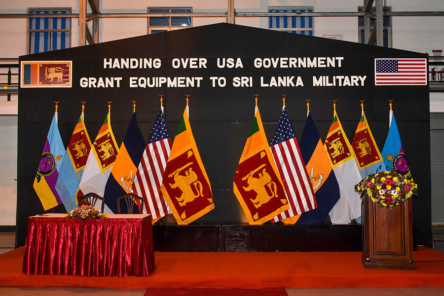 An airman sanitizes indoor shooting stations.