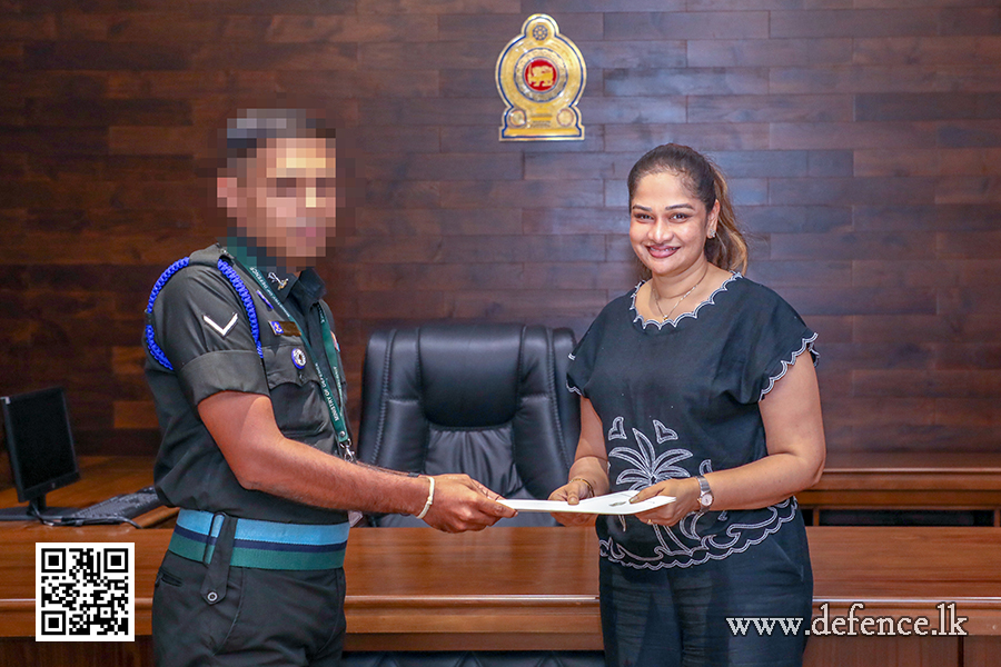 An airman sanitizes indoor shooting stations.
