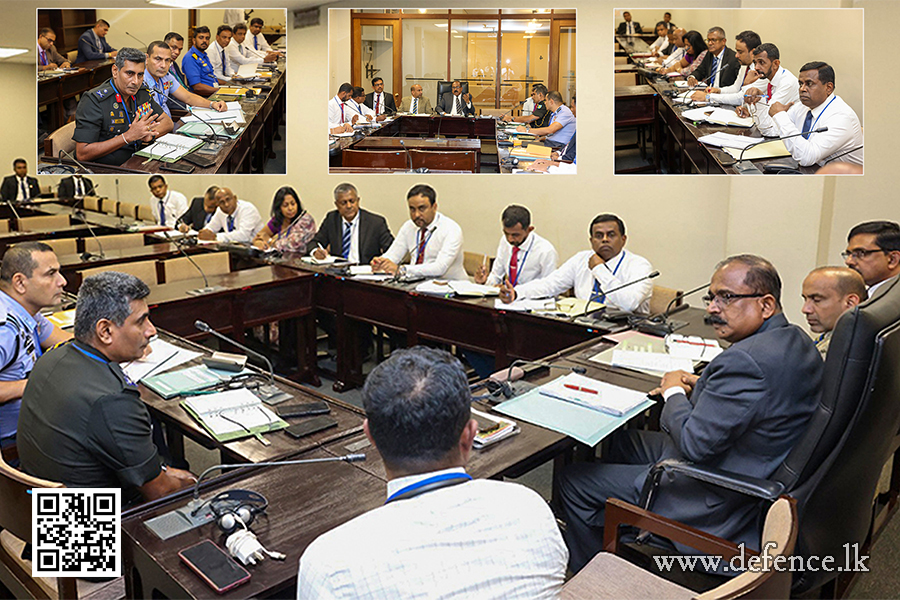 An airman sanitizes indoor shooting stations.